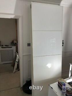 4 IKEA sliding wardrobe doors 2 pax mirrored 2 white. Length 231cm Width 76.5mm
